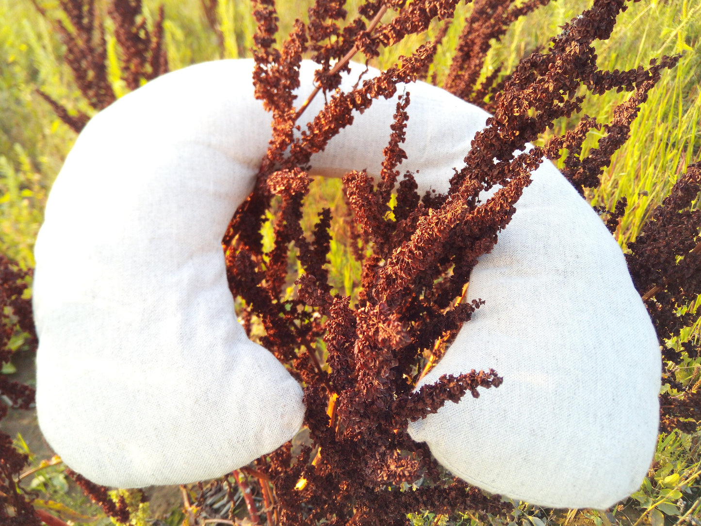 Organic hemp neck pillow filled with buckwheat hulls, Hemp fabric outside hulls inside