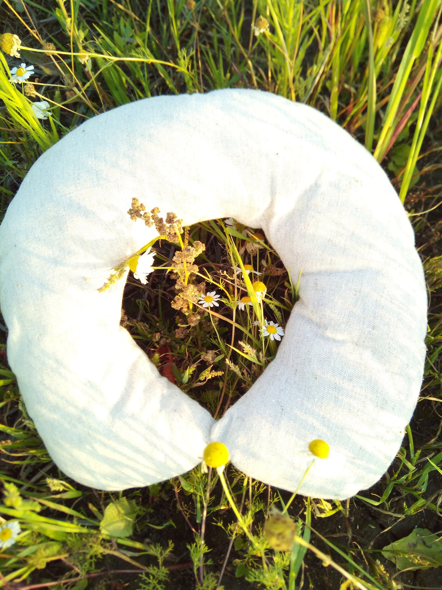 Organic hemp neck pillow filled with buckwheat hulls, Hemp fabric outside hulls inside