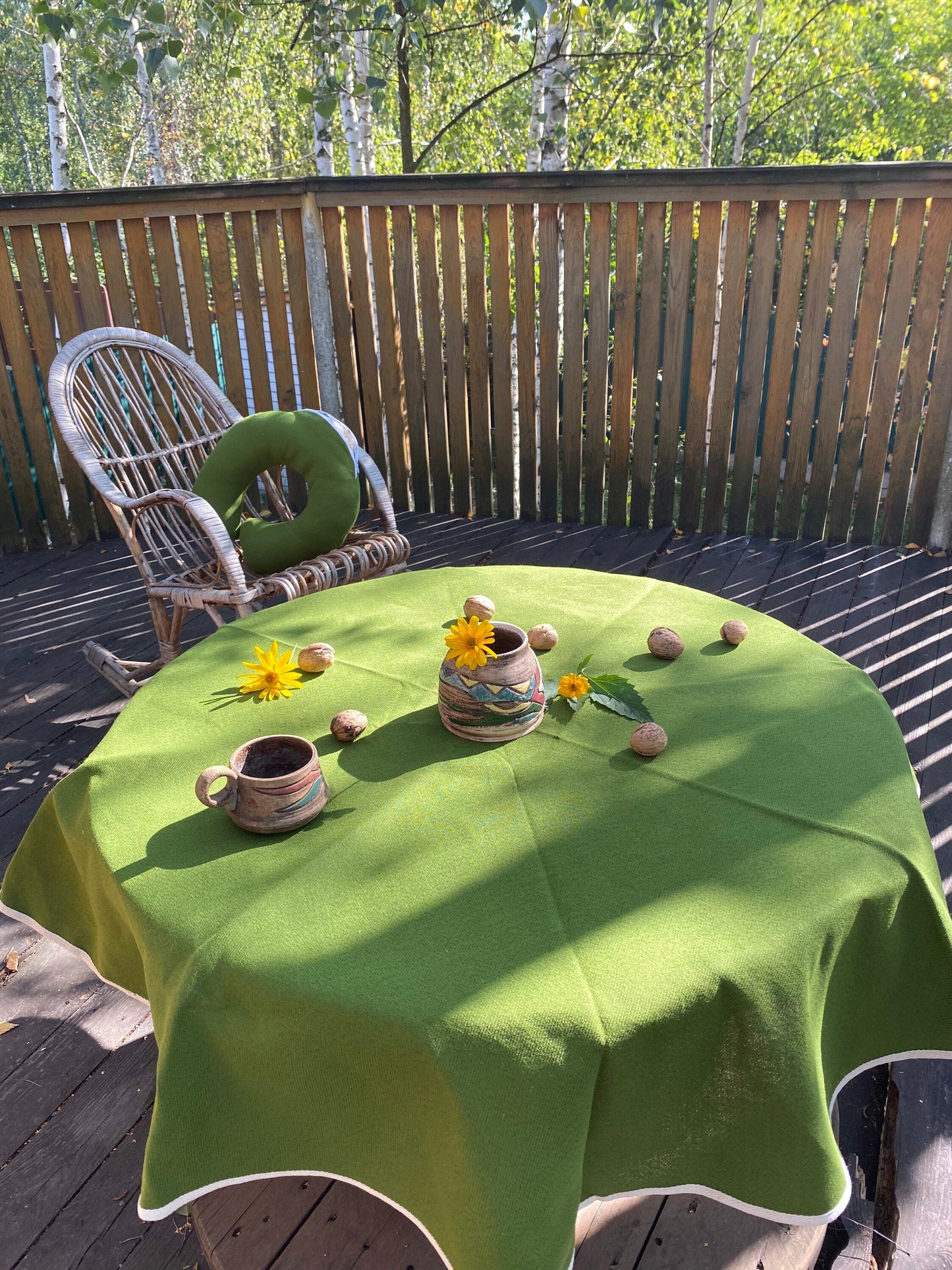 Green hemp round tablecloth made of organic cloth with white sides