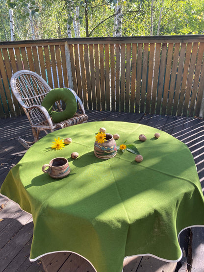 Green hemp round tablecloth made of organic cloth with white sides