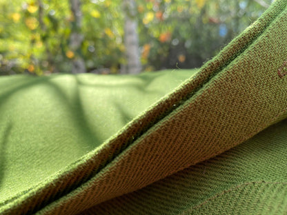 Green hemp round tablecloth made of organic cloth with white sides
